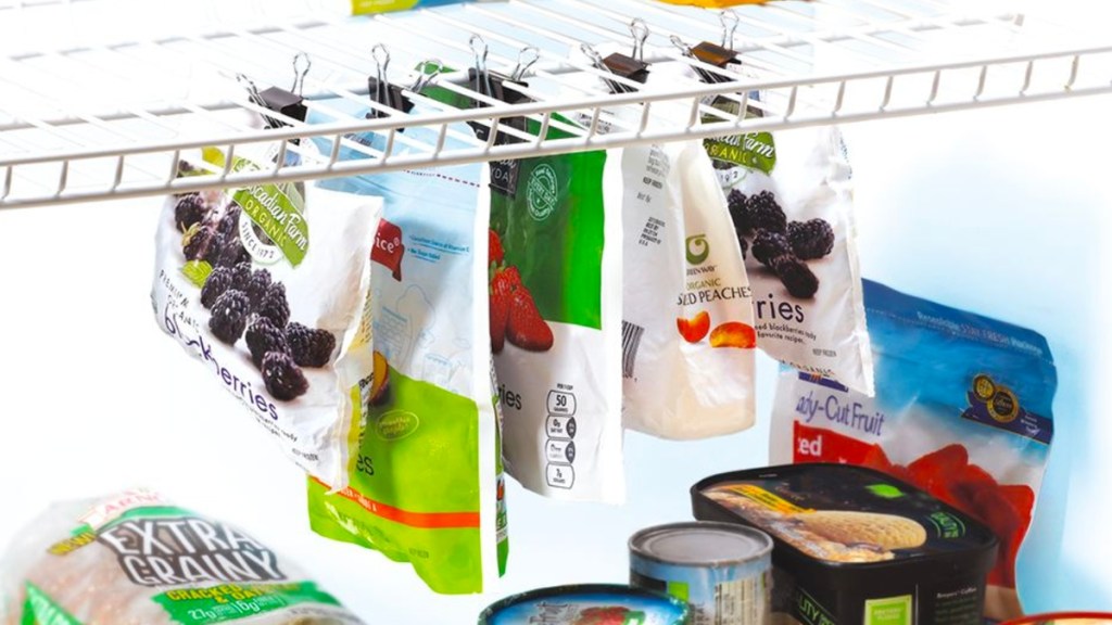 Binder clips being used to organize frozen food
