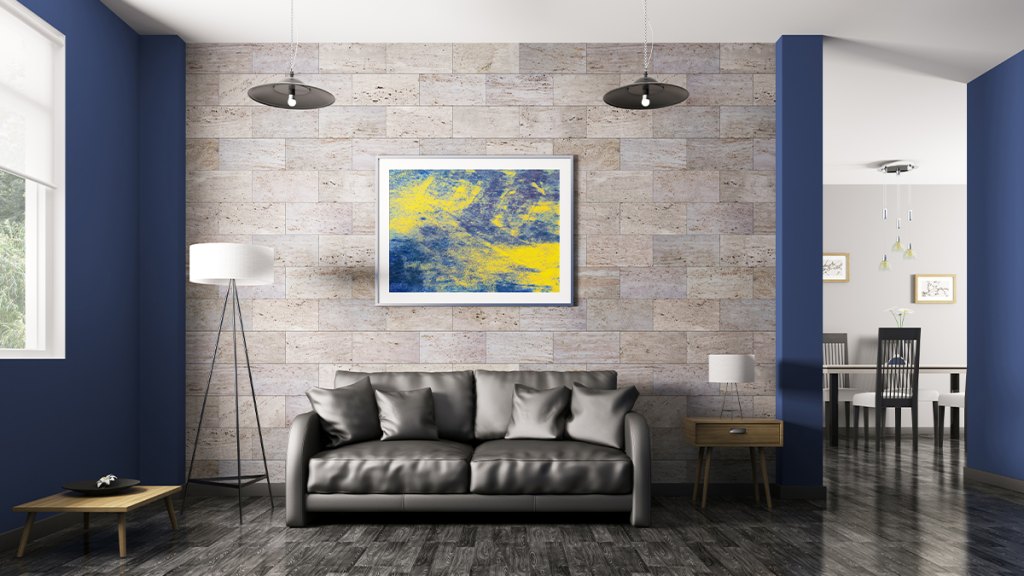 stone wall with a picture frame hanging on it