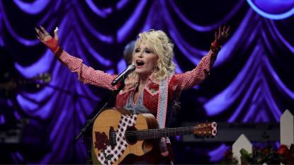 dolly parton singing; country songs about women lead photo