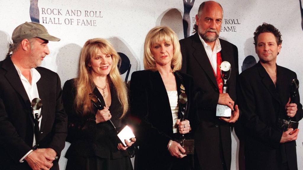 Group of people holding awards; Fleetwood Mac Rumours
