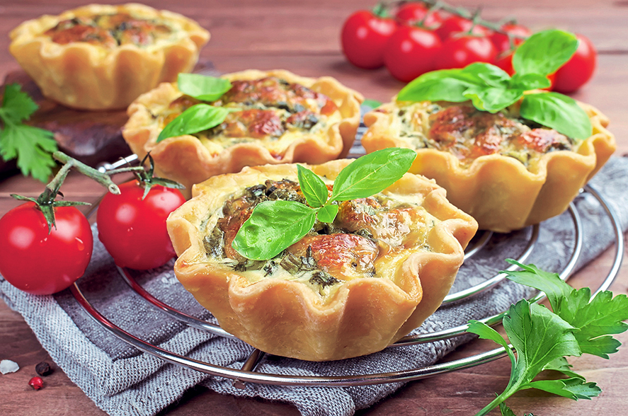 Winter brunch ideas: Baked homemade quiche pie in mini metal forms