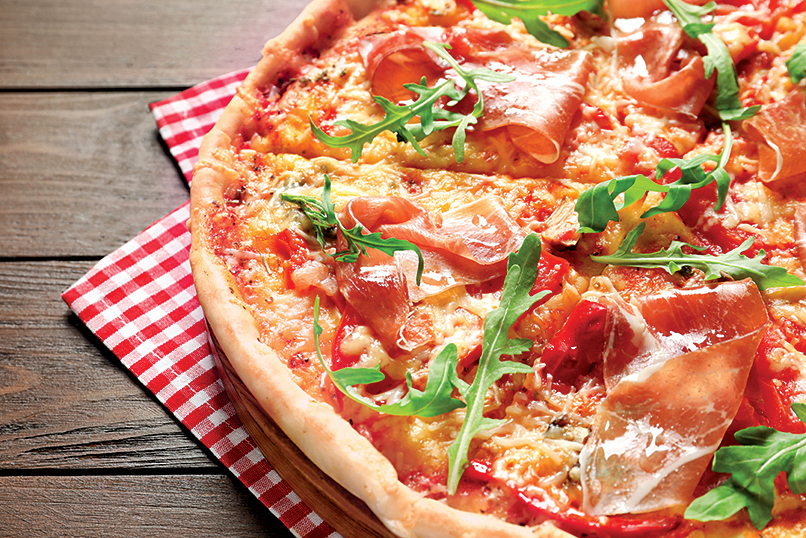 Pizza party: Tasty hot pizza with meat on wooden background