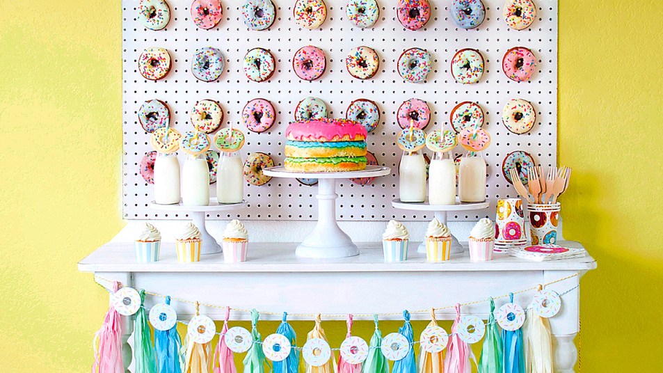 Donut party: lede table with treats and donut wall on wall above table