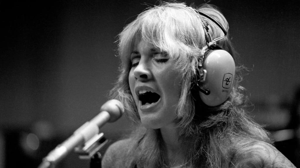 woman singing in the studio