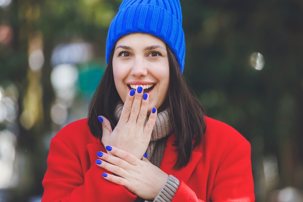 Woman with cobalt blue nails