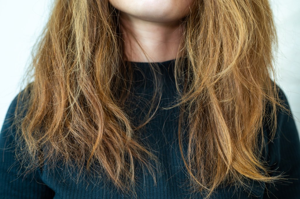 Close up of woman's dry, damaged hair