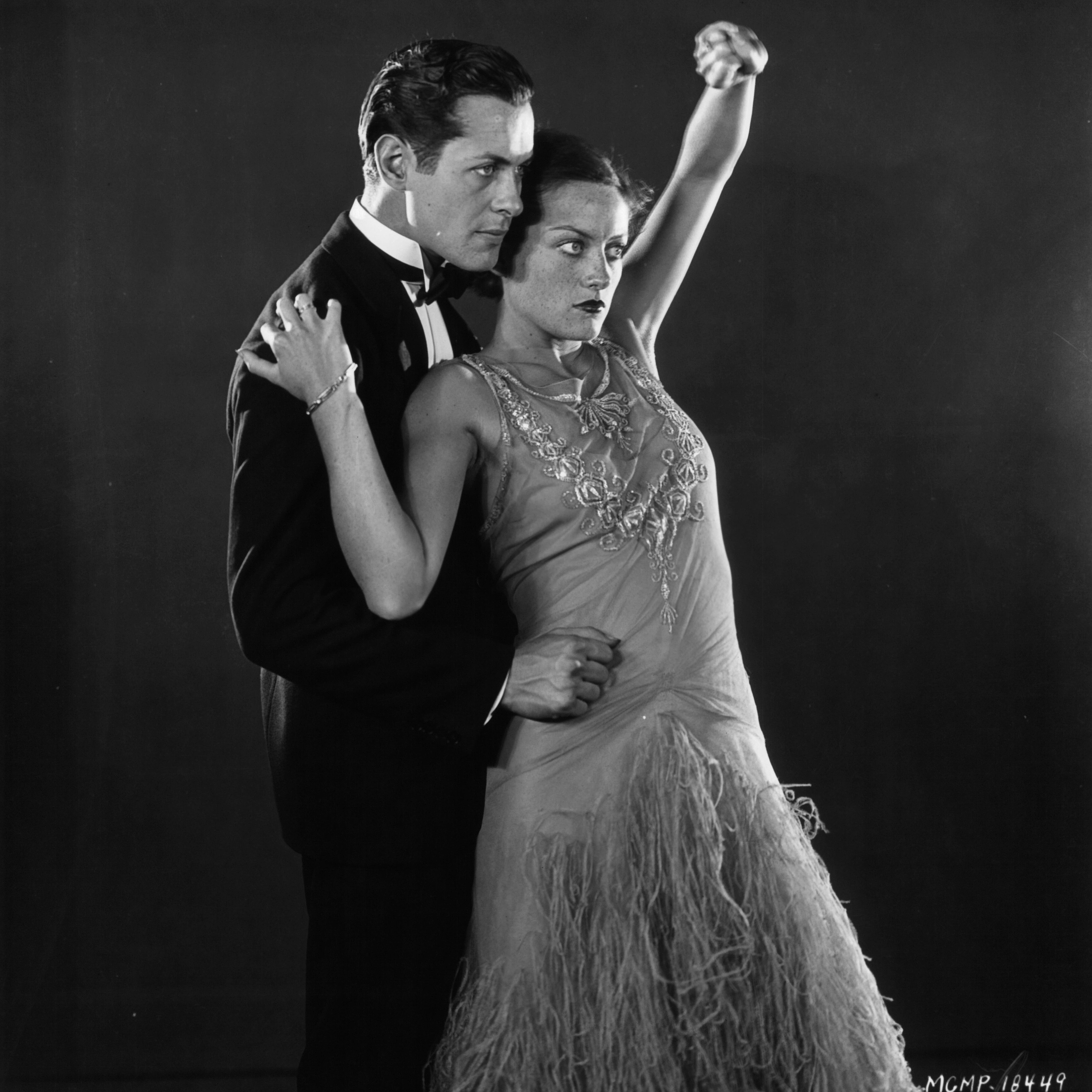 Robert Montgomery dances with Joan Crawford in a publicity portrait for Untamed, 1929