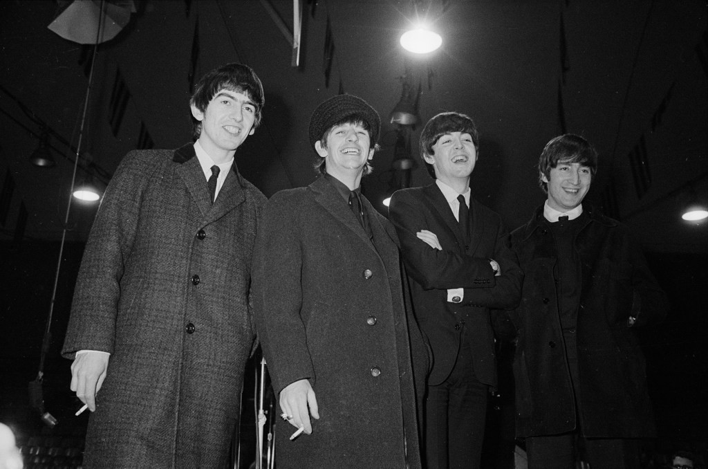 The Beatles heading to a press conference in Washington, DC in 1964