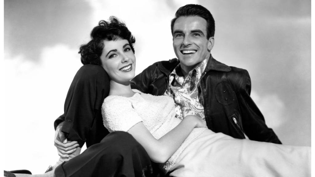 Woman leaning on man; young Elizabeth Taylor