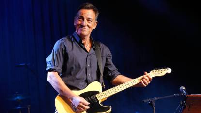 Bruce Springsteen playing guitar onstage