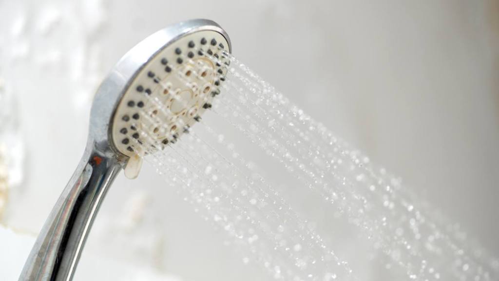 A shower head and running water, which helps relieve sinus pressure in ears