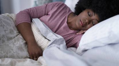 tips for sleeping: Mature woman sleeping in bedroom