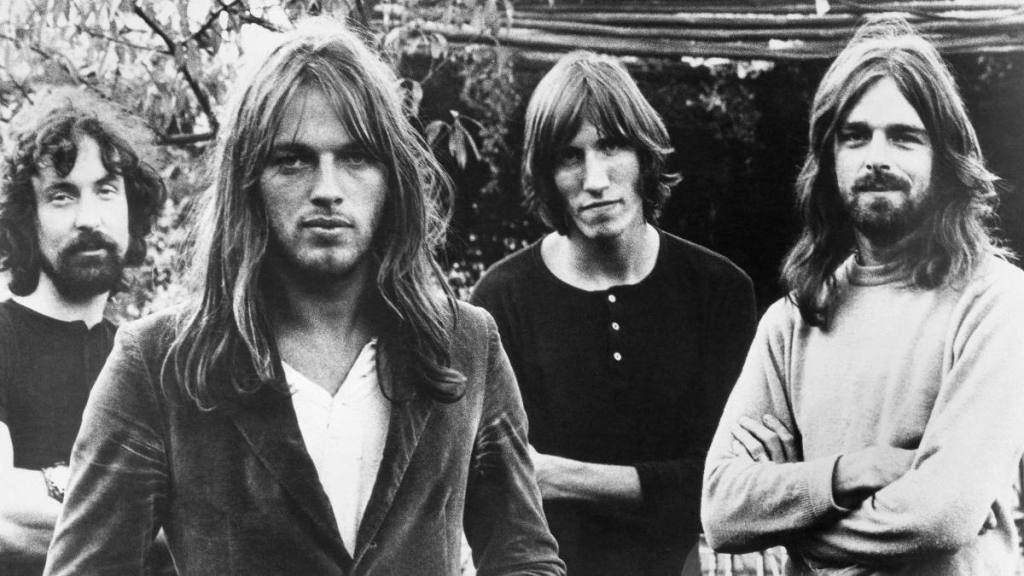 3. Group of men posing; greatest rock bands of all time