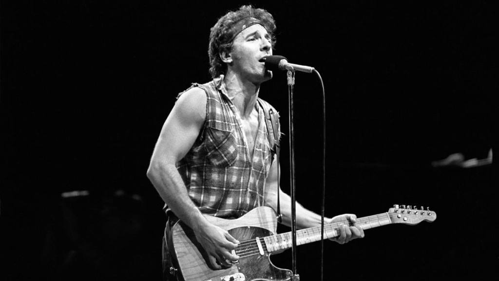 Bruce Springsteen with a guitar onstage