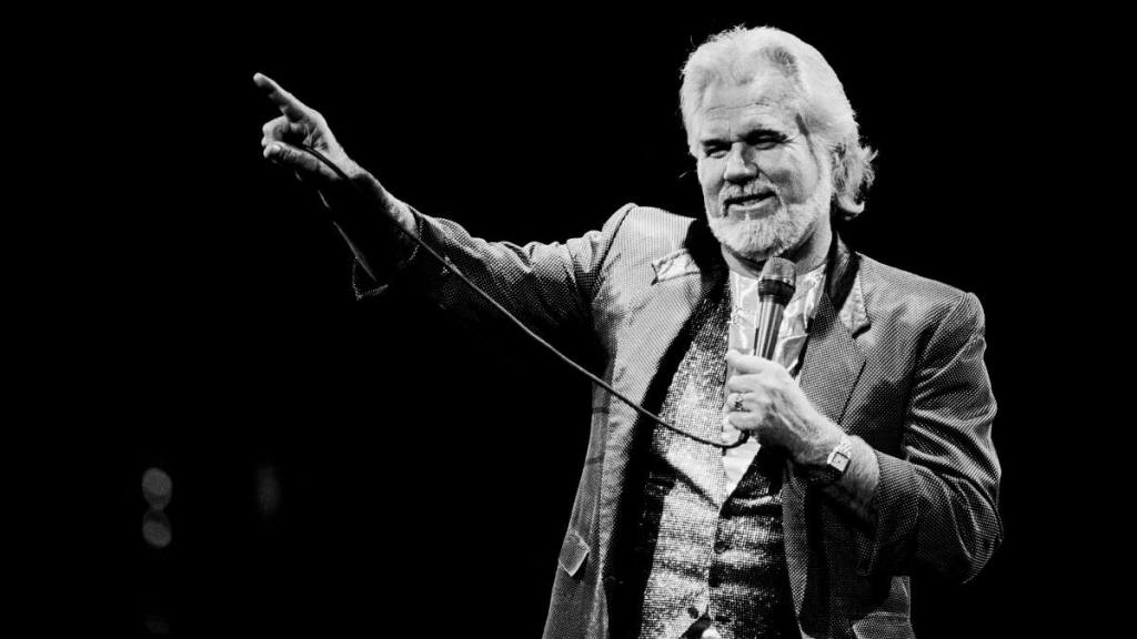Kenny Rogers with a microphone; Kenny rogers songs