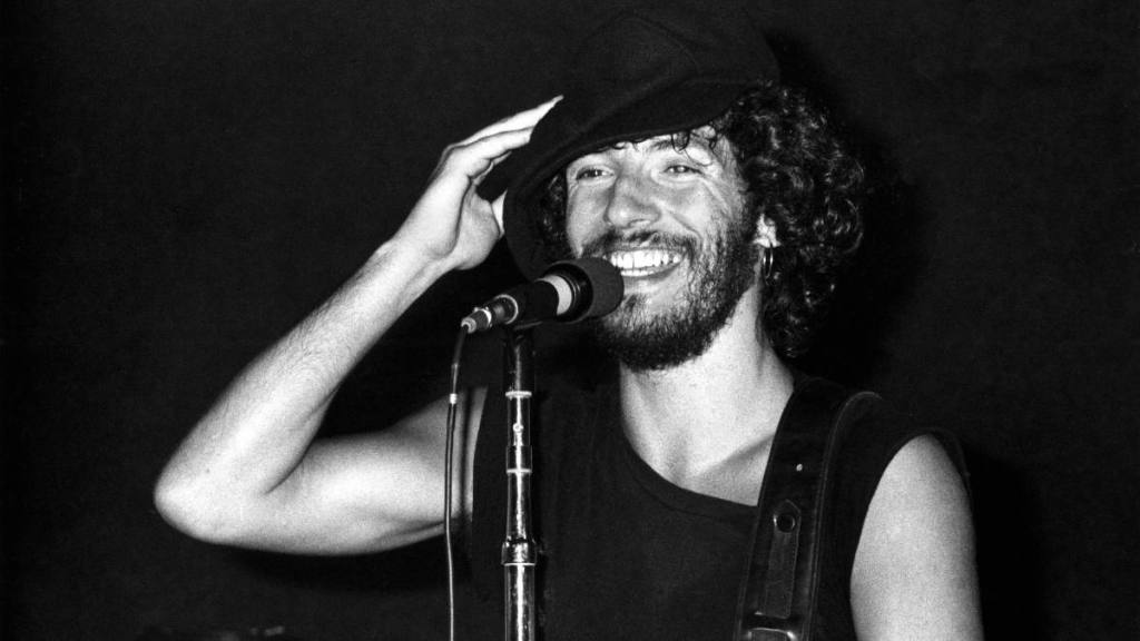 Bruce Springsteen smiling onstage