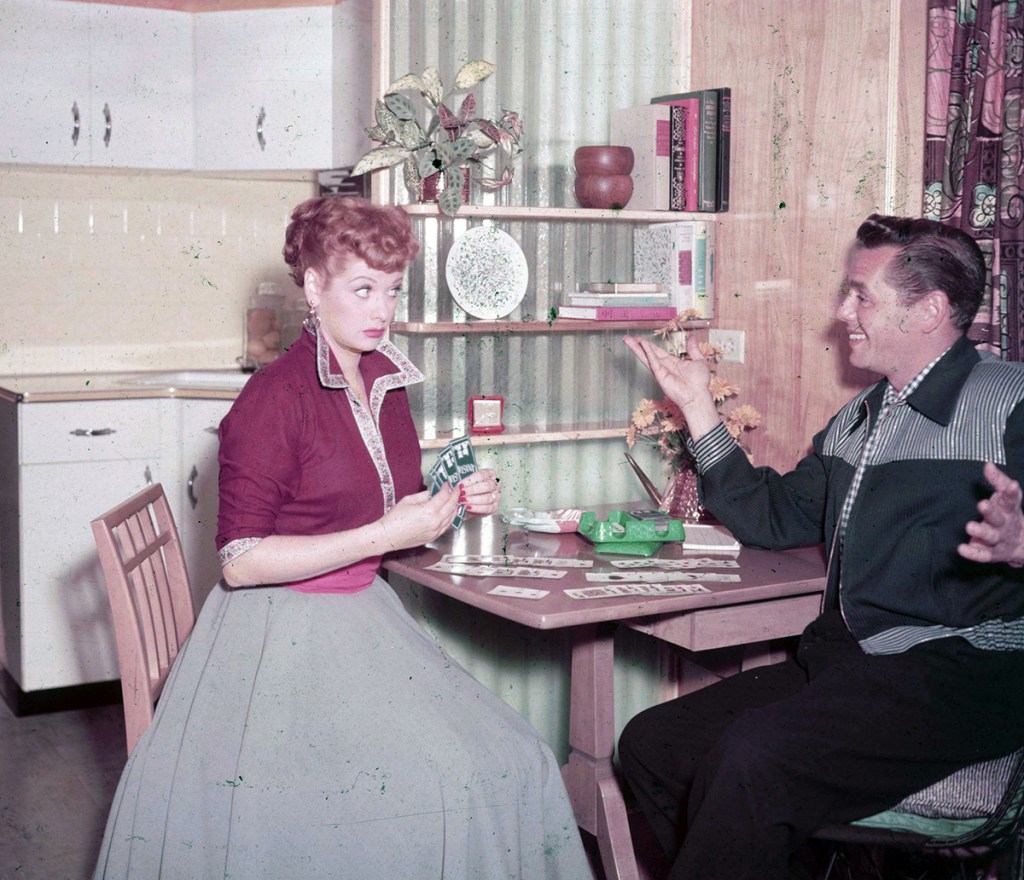 Lucille Ball and Desi Arnaz playing cards