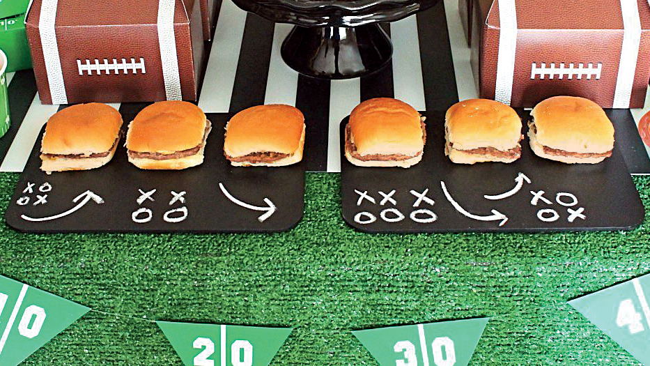DIY football decorations: Sliders displayed on slate boards decorated with edible marker play calls