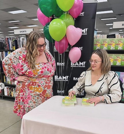 Tessa Bailey signs books at an event