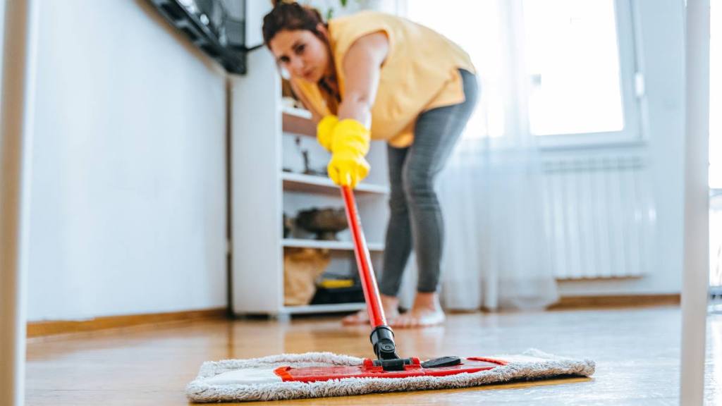homemade all purpose cleaner: Barefoot woman cleaning floor with wet mop pad