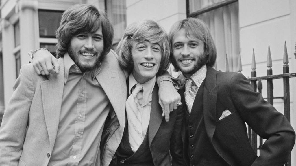Bee Gees brothers with arms around each other