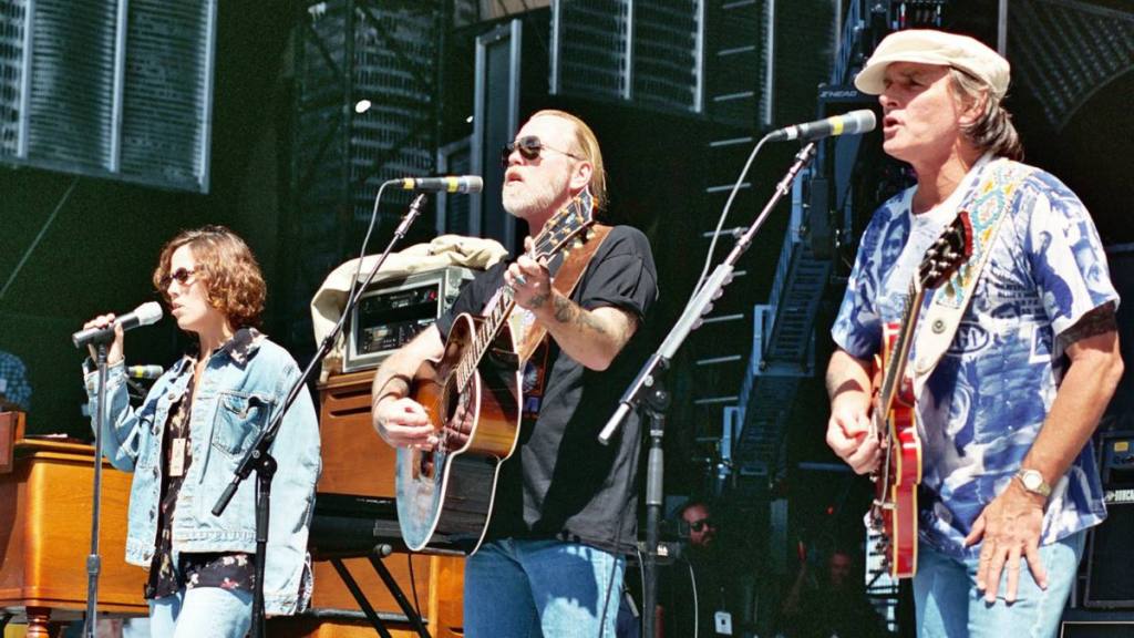 Group performing on stage; Allman Brothers Bands
