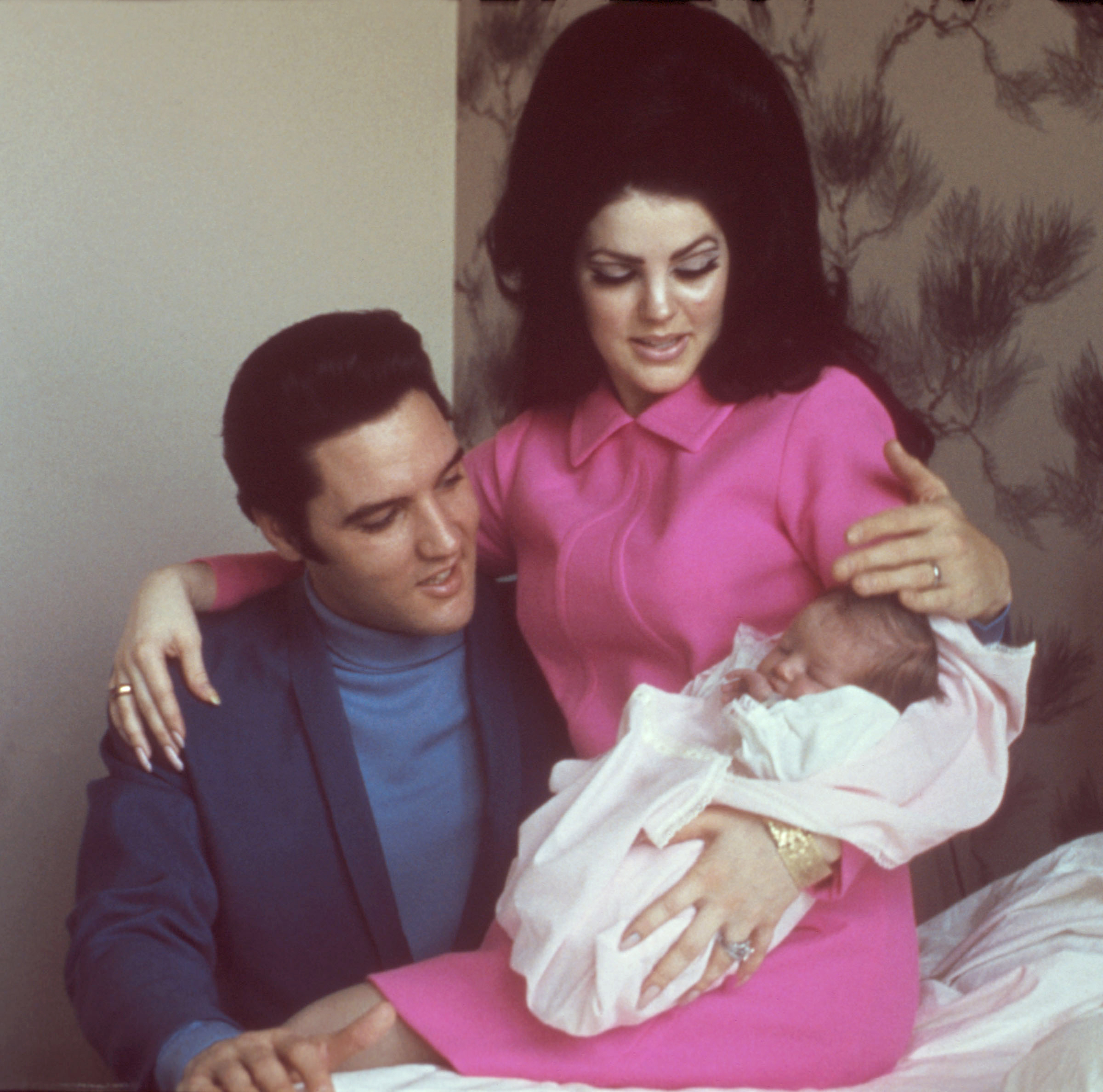 The couple holds their daughter, Lisa Marie, 1968
