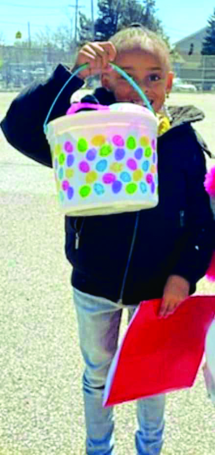 Little girl holding Easter basket