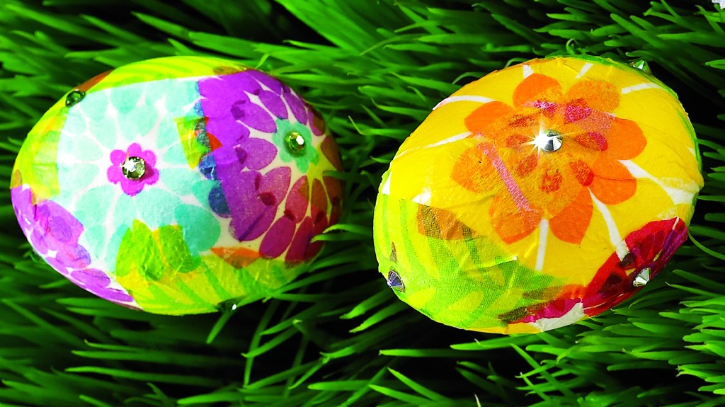 Cool easter egg designs: Two eggs decoupaged eggs decorated with floral-patterned paper napkins and rhinestones