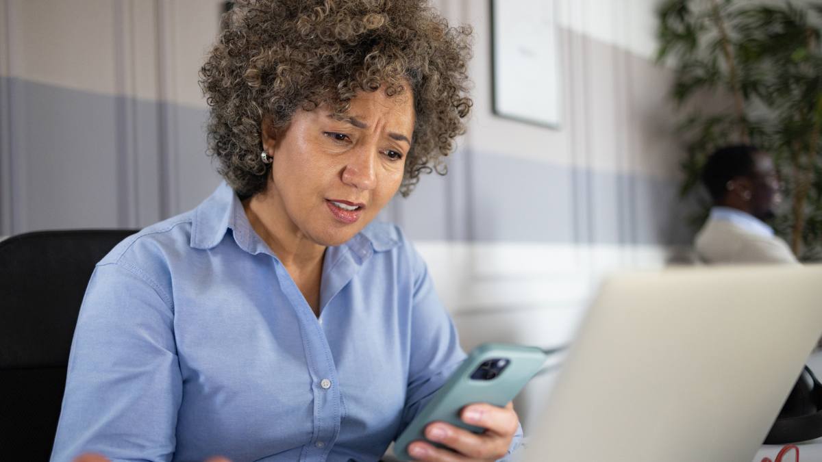 Woman figuring out how to protect herself from AI Scams