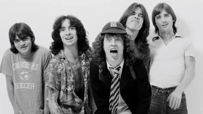 Rock band smiling, tongues out; ACDC Band members