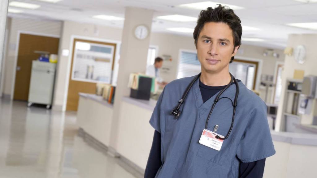Doctor smiling; facts about scrubs
