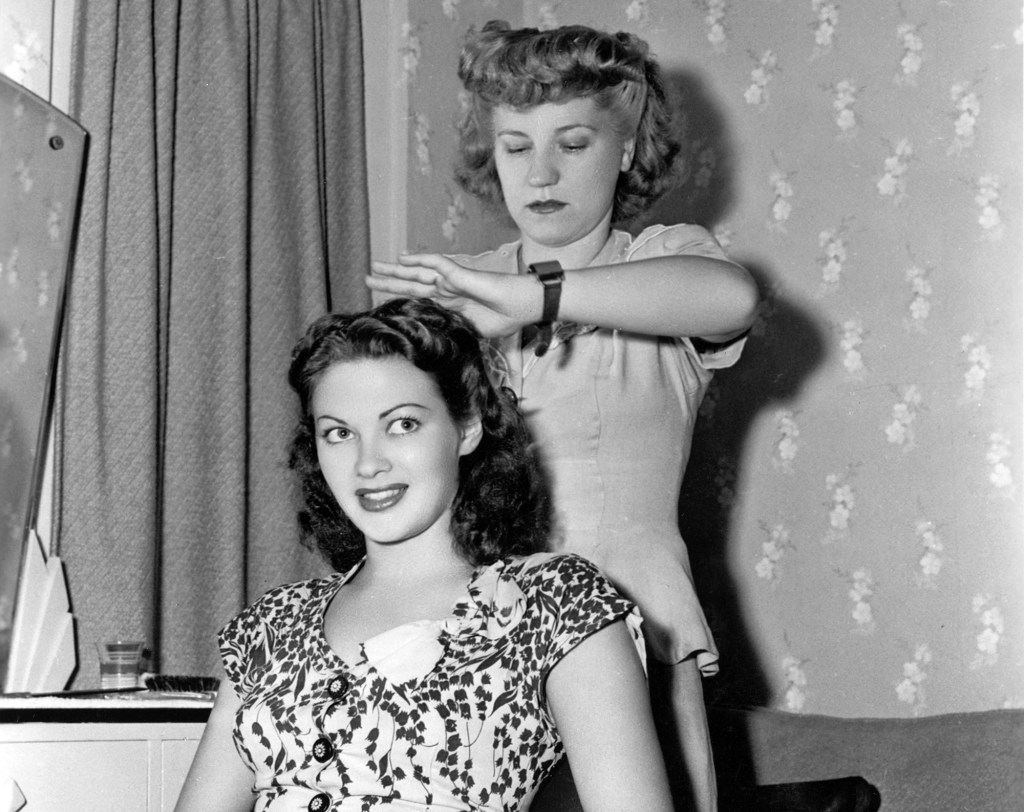 Canadian actress Yvonne De Carlo has her hair styled by Carla on the set of the Universal Pictures film Salome Where She Danced,'1944 