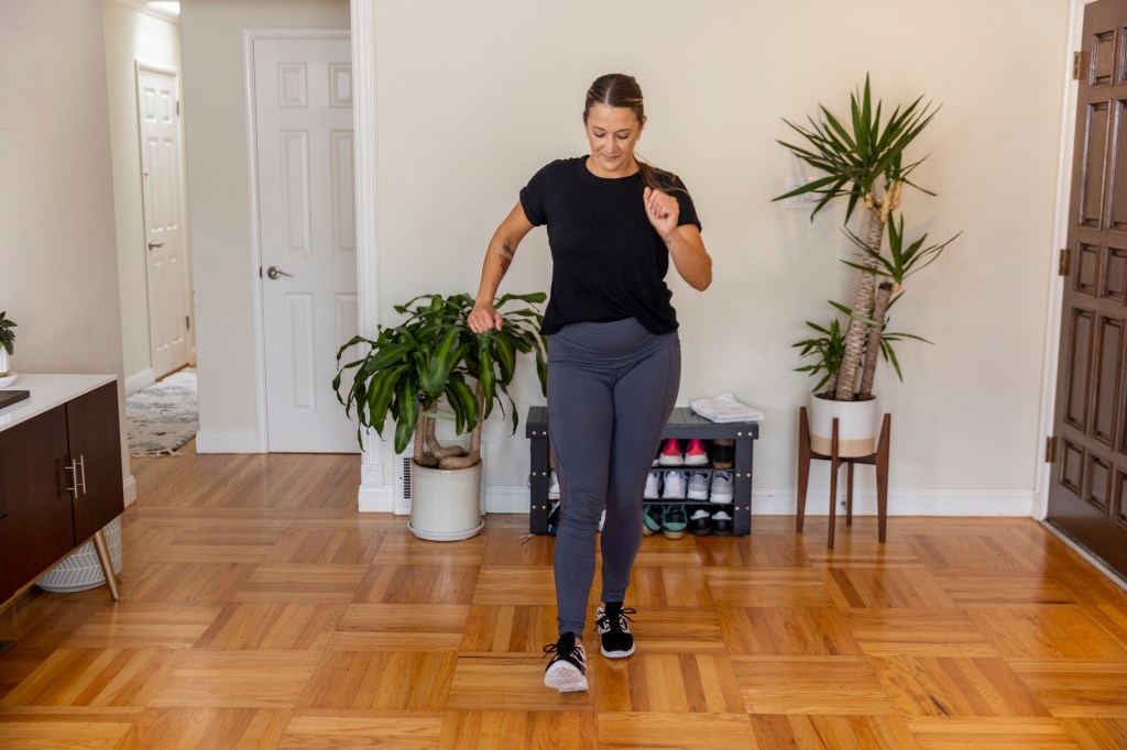 Woman doing a walking workout indoors