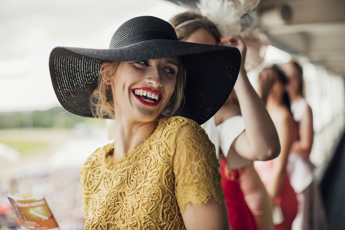 A young beautiful woman on ladies day, smiling and laughing at friends.