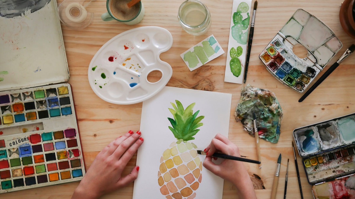 Close-up of woman's hands as she learns how to watercolor