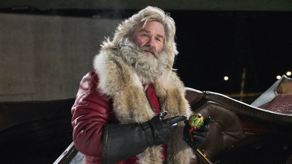 man dressed as Santa Clause; kurt russell