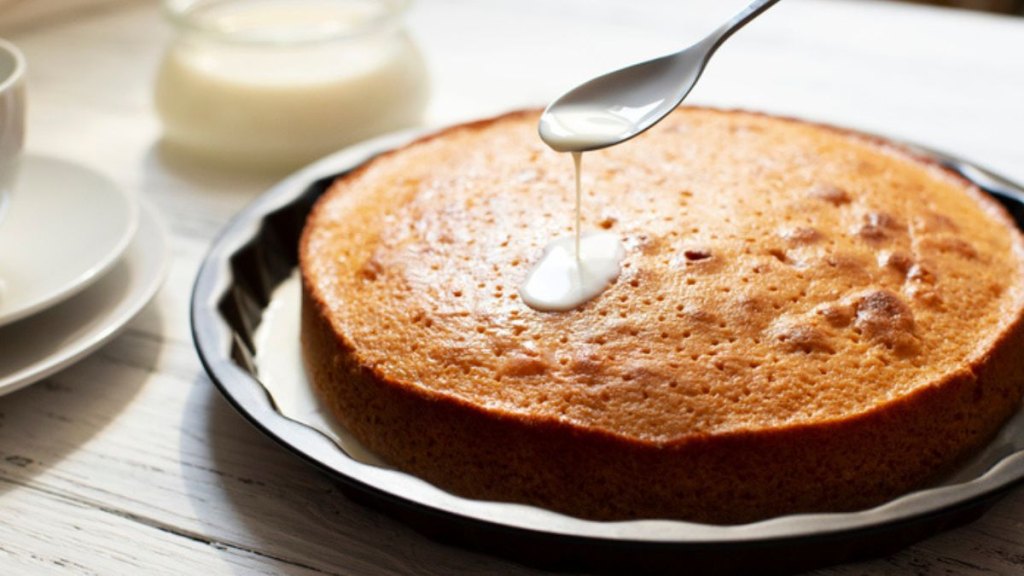 tres leches cake with milk soak poured on top