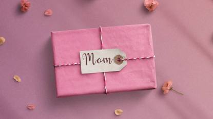 Gifts for Mother's Day: Pink gift top view. mothers day text on banner