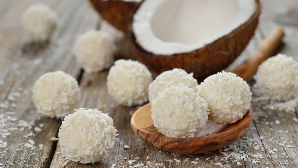 Coconut praline on a wooden background