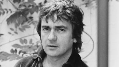 Man looking at camera; Dudley Moore movies and tv shows