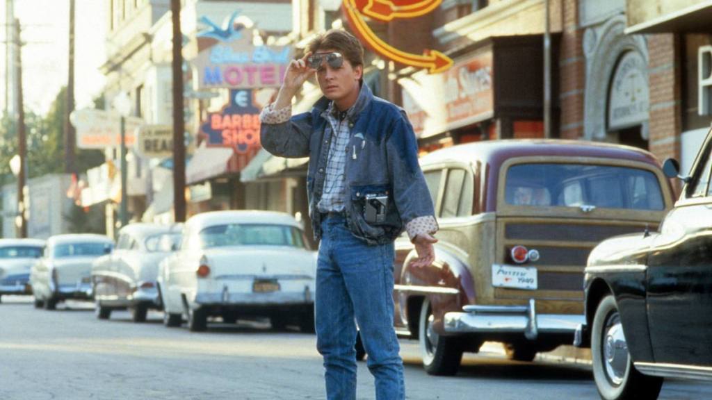Michael J Fox walking across the street in a scene from the film 'Back To The Future', 1985. (