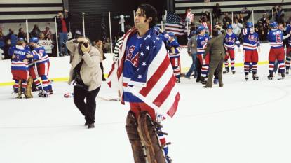 Man with American flag looking happy ; patriotic movies
