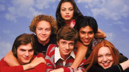 Group of friends laying on top of each other; That ‘70s Show cast
