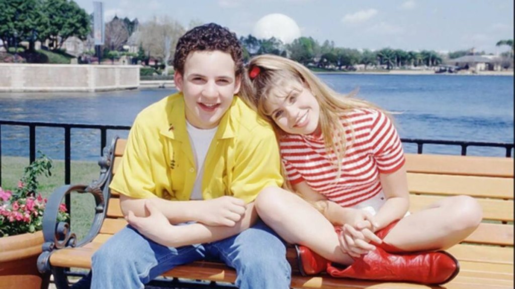 Girl resting head on boys shoulder