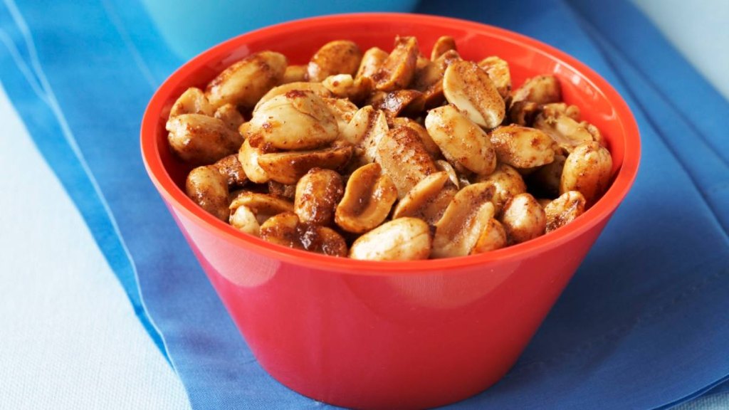 Two Bowls of Mixed Spiced Nuts on Blue Napkins