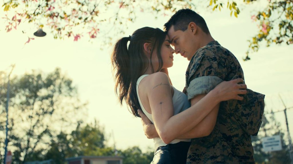 Man and woman holding each other ; patriotic movies