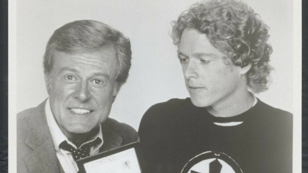 man with mic and boy