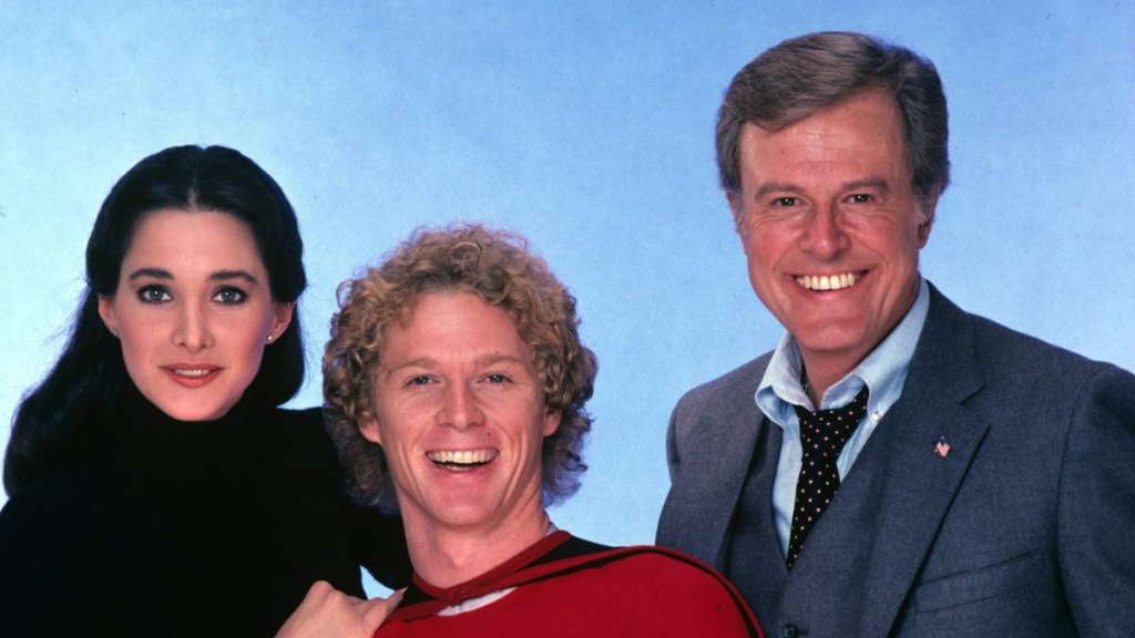 woman and two men laughing