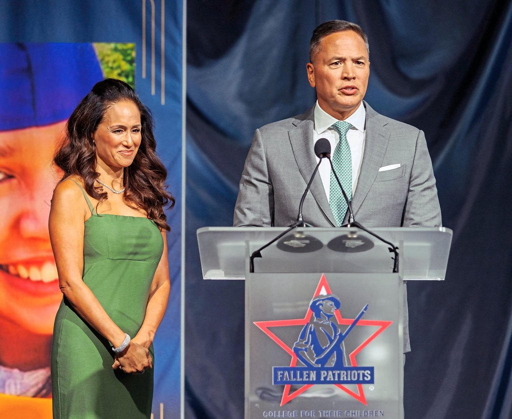 David Kim (right), founder of the scholarships for children of fallen heroes, with his wife (left)
